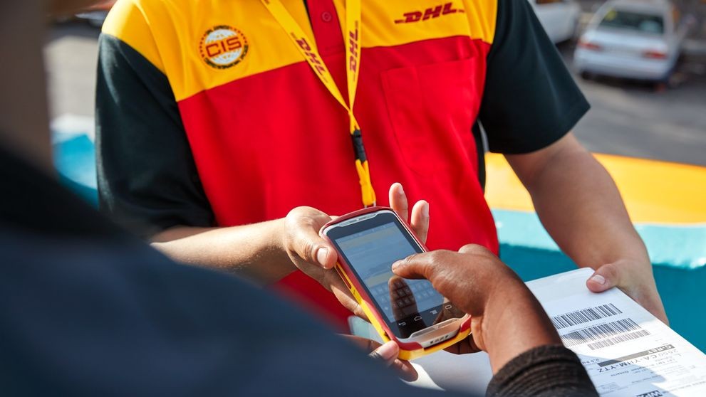 DHL personnel engaging in their paperless trade services