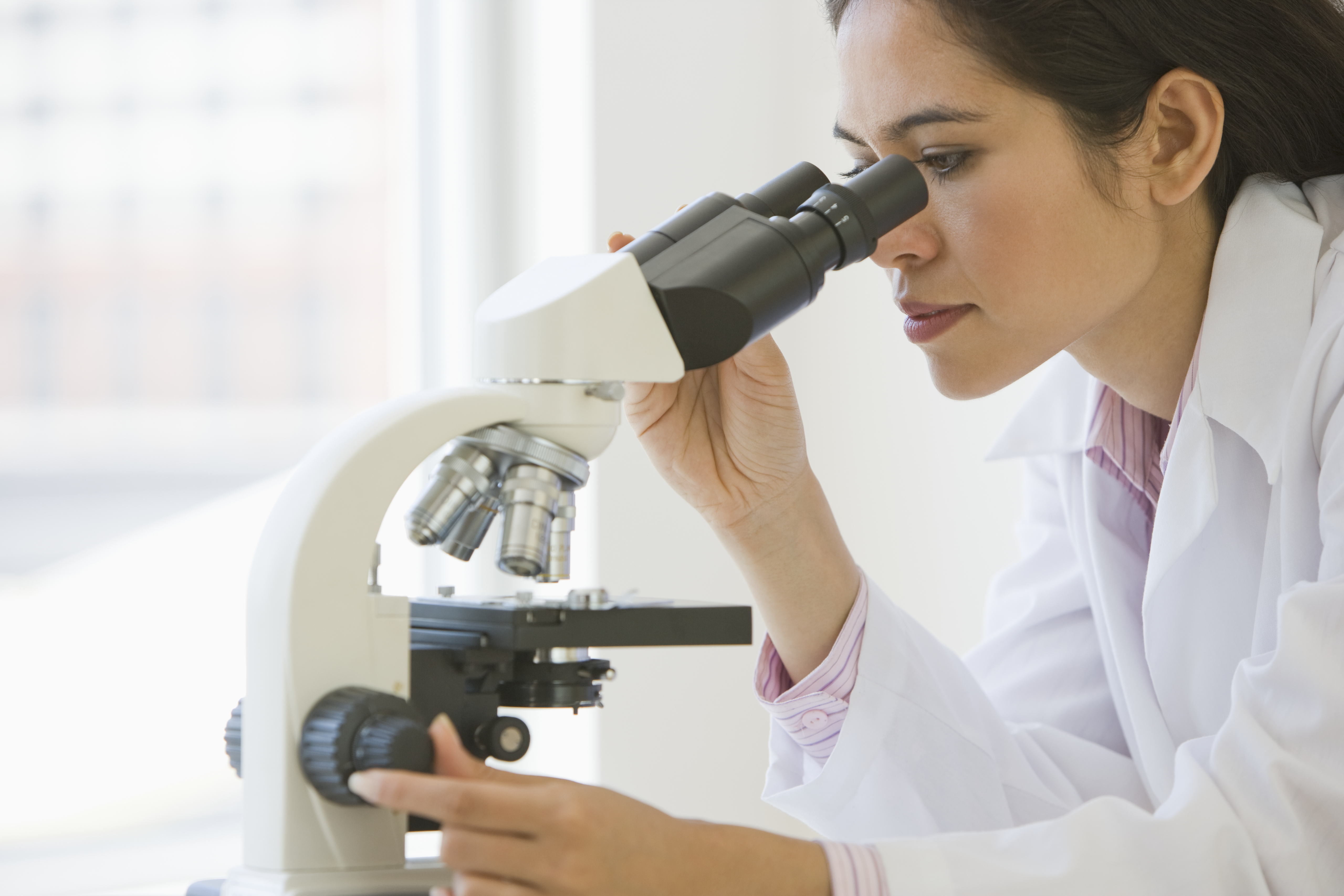 scientist-looking-through-microscope