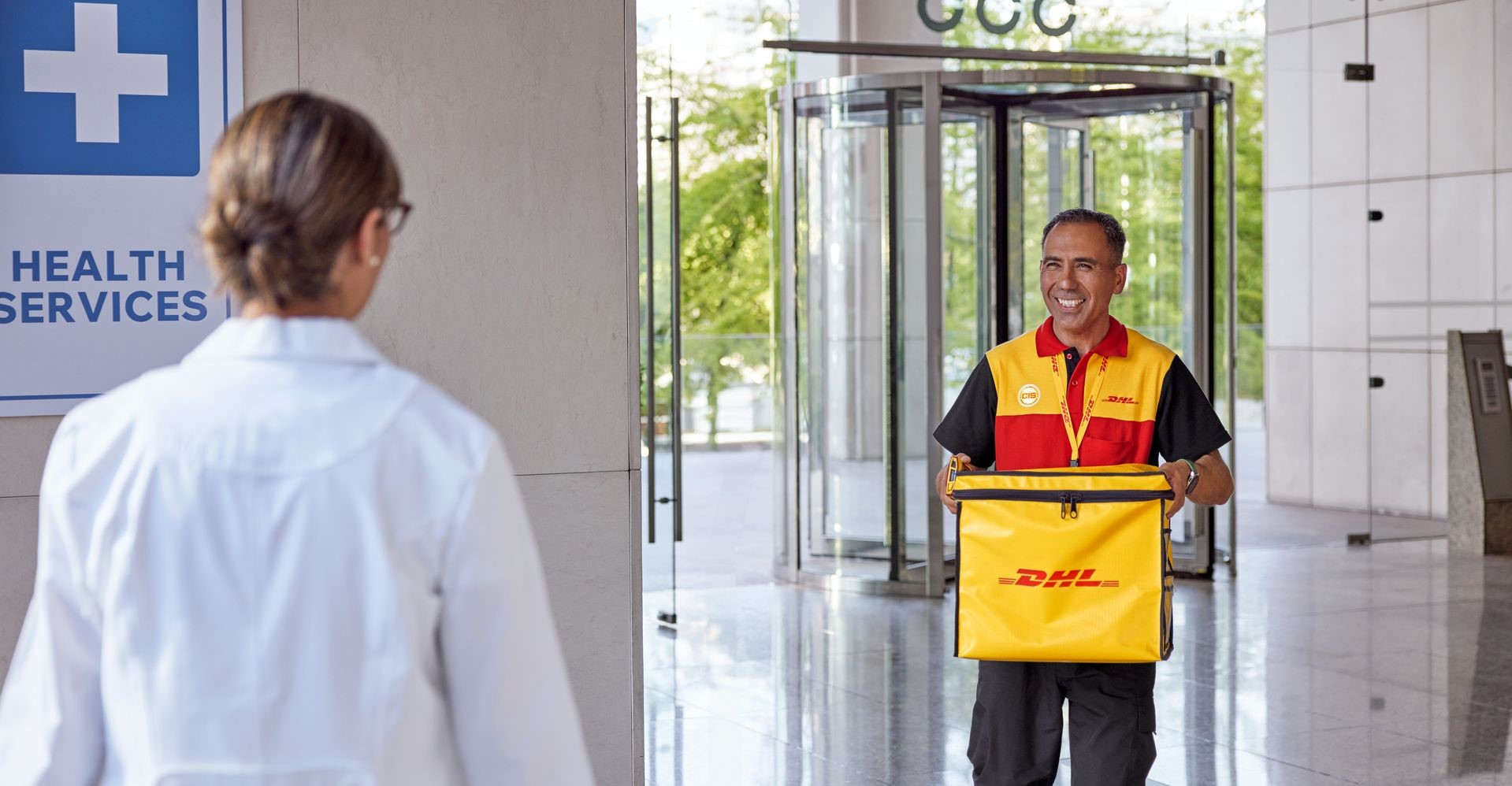 dhl express employee delivering temperature sensitive products to a hospital