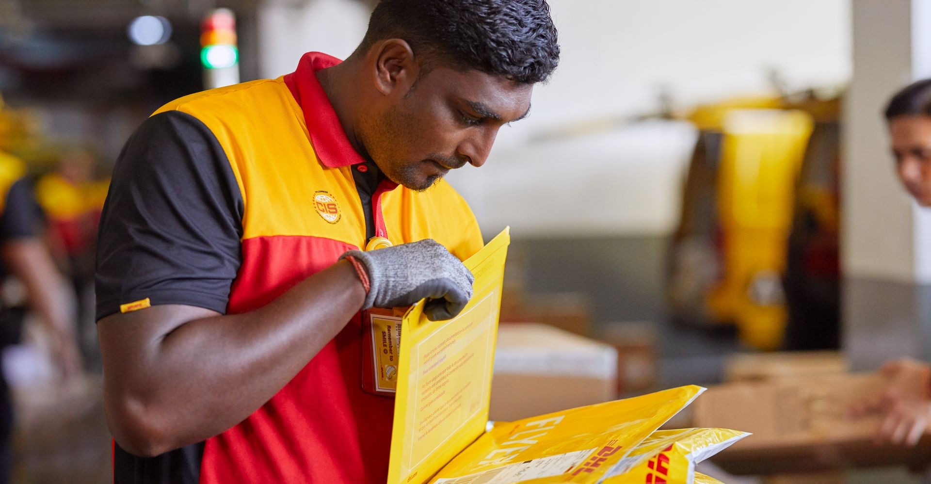 dhl courier sorting out parcels
