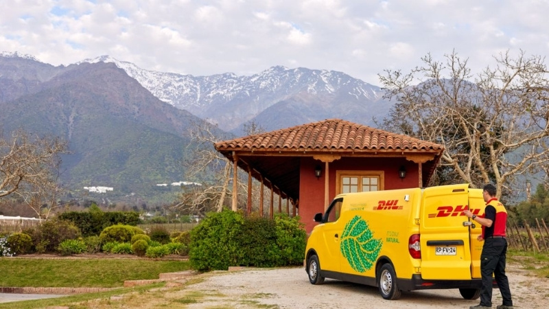 Courier closing back door of the e-van