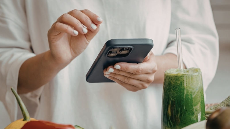 Woman holding her phone