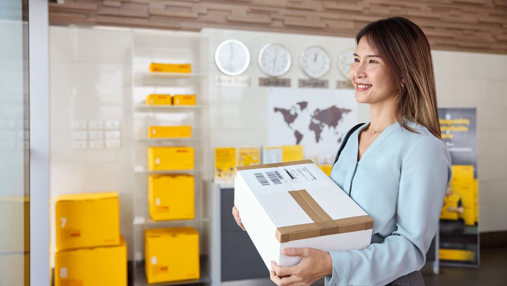 female customer picking up dhl express parcel