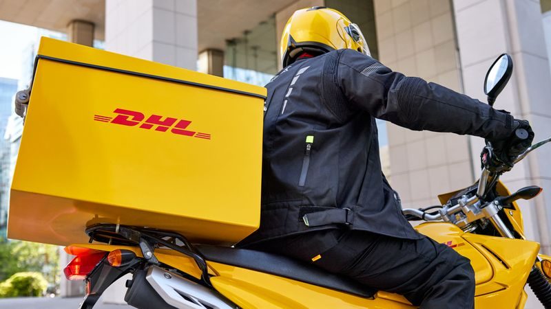 DHL personnel sending parcel for overseas shipping