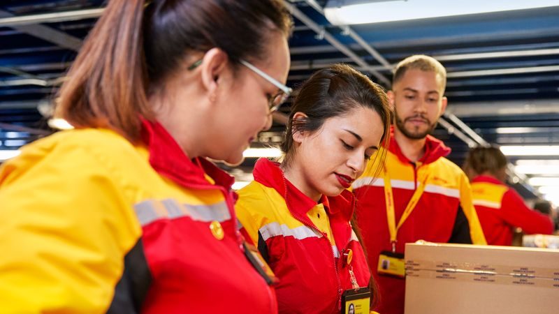 DHL Express employees managing exports to Japan