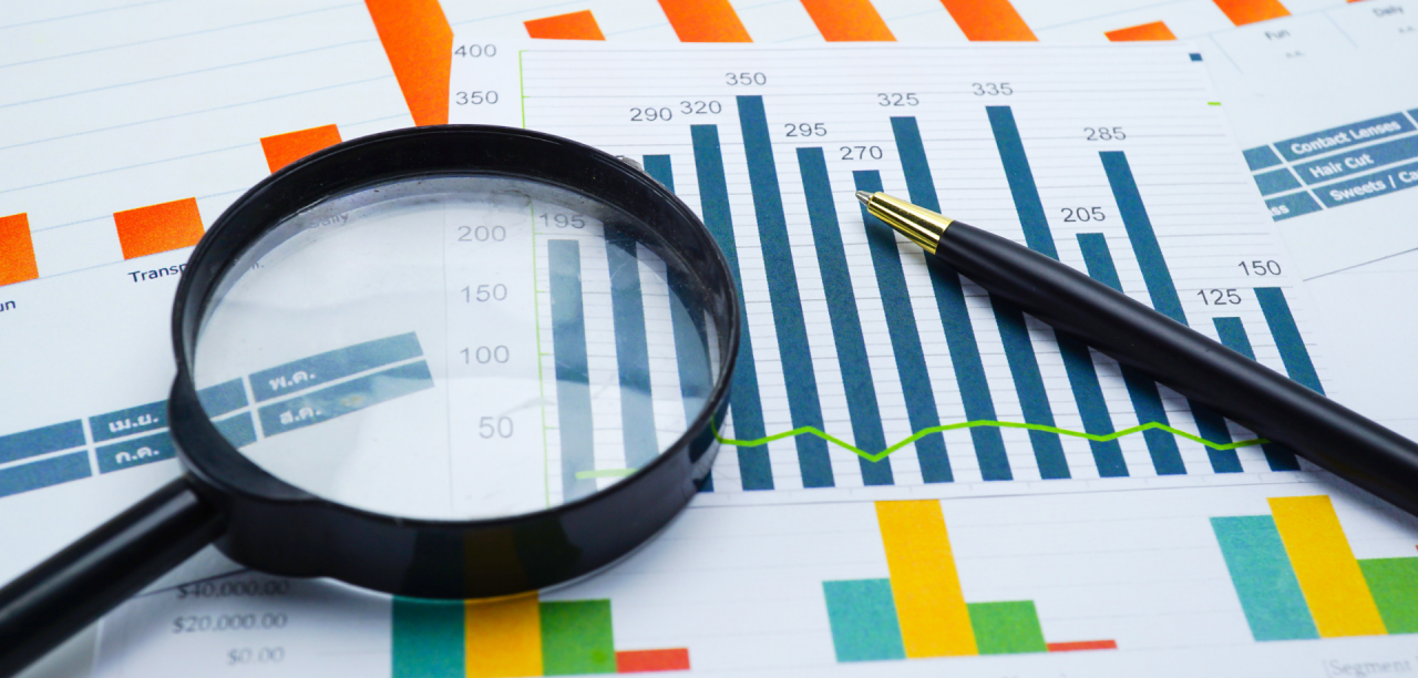 report and magnifying glass