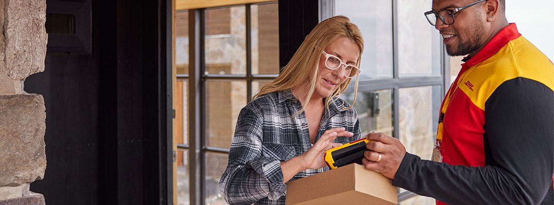 Person recieving a parcel from a DHL courier