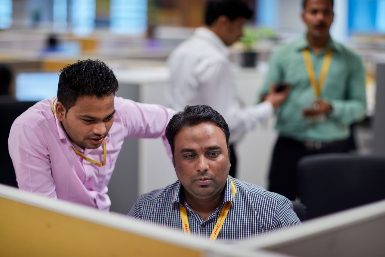 DHL express staff in india coordinating international shipments