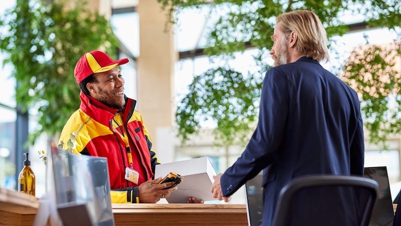 dhl courier talking to a receptionist