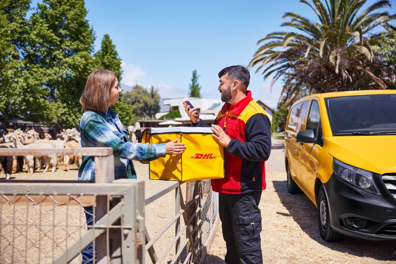 DHL employee delivers a package