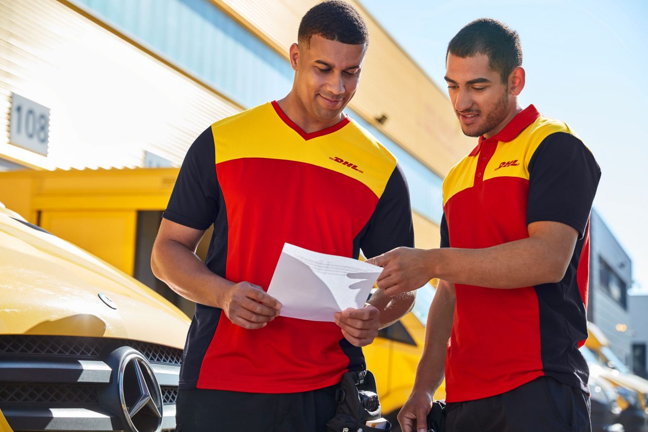 Two men looking over documentation