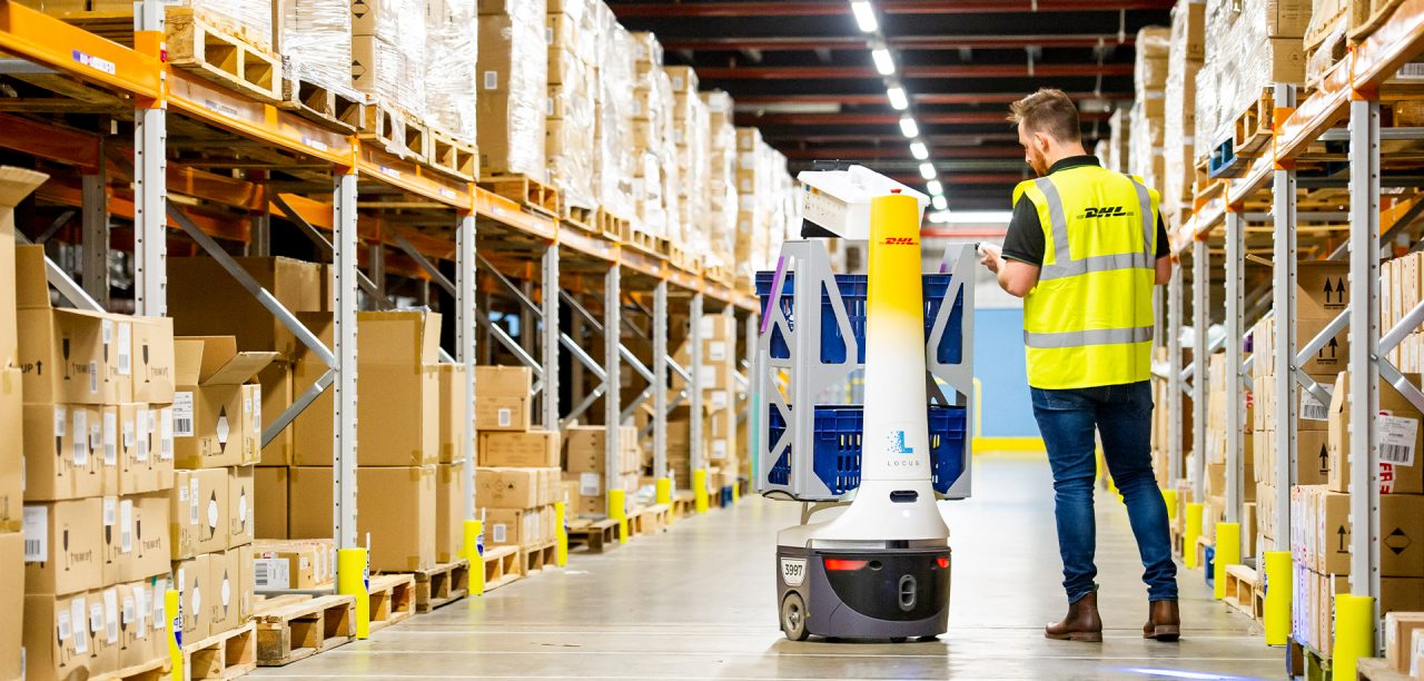 Human and Tech Work alongside in warehouse