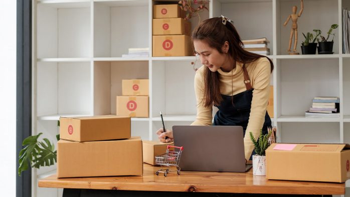 woman labelling parcels