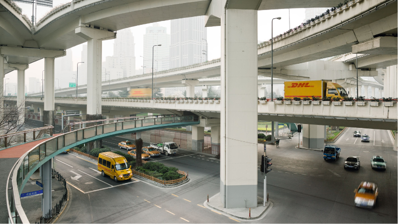 DHL vans run in a city of China